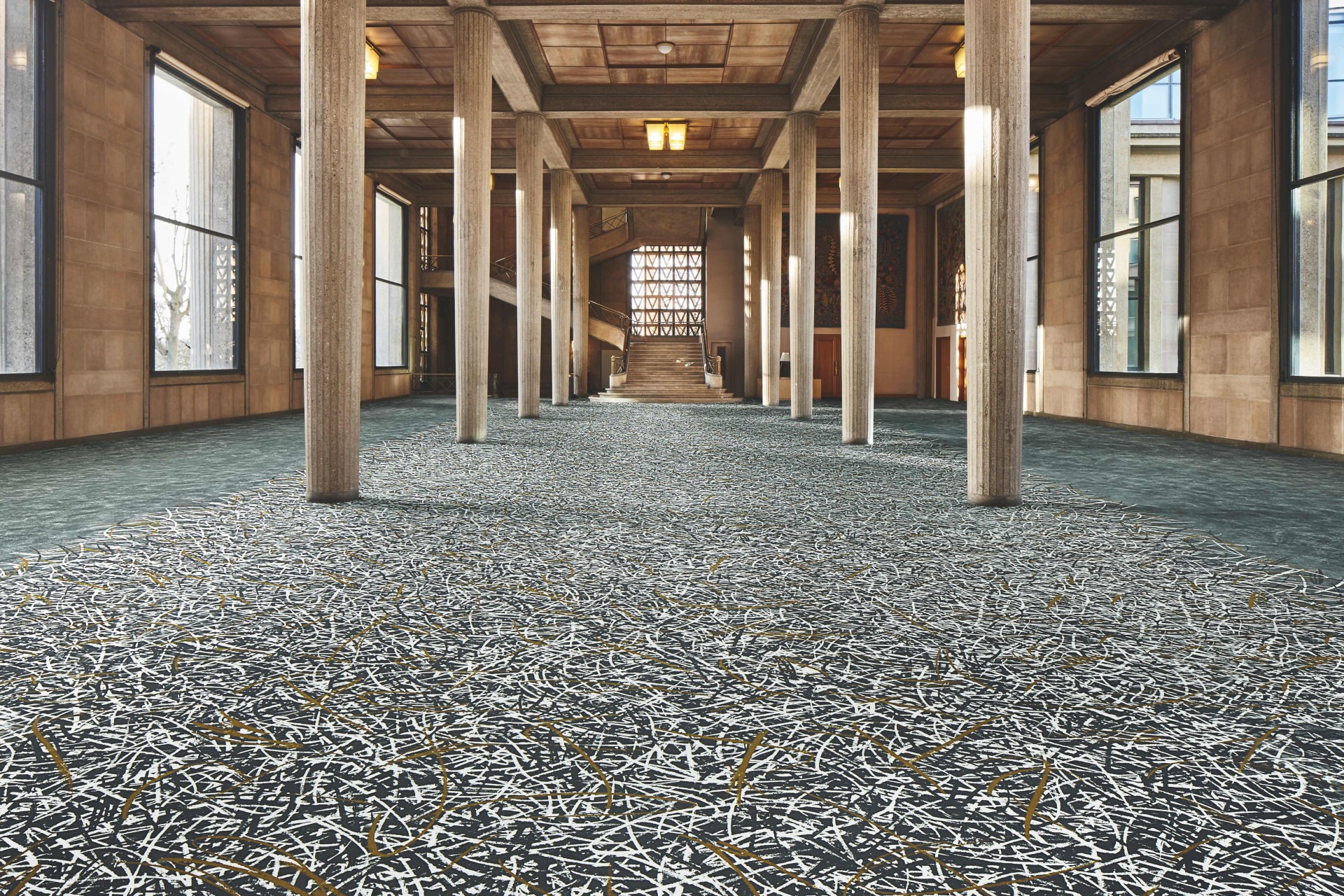 Designér Philippe Starck navrhl plošné vzory skládané z kompetentů pro libovolnou kombinaci. Systém Vortex ve variantě gold.