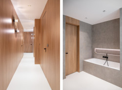 Dveře MASTER ve skryté zárubni a obkladu EFEKTA vytvářejí jednu rovinu. V koupelně je patrná souhra dřevodekoru a kamenných povrchů. Povšimněte si sjednocené podlahy.