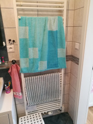 Vytápění bylo řešeno topným žebříkem.