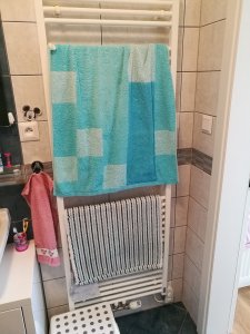 Vytápění bylo řešeno topným žebříkem.