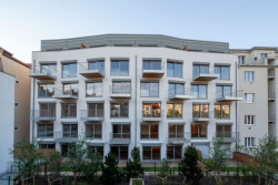 Bytový dům Sámova, Znamení čtyř - architekti