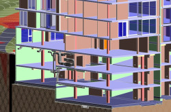 Pohled na vzduchotechnické rozvody v suterénu stavebního objektu.