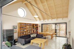 Rodinný dům na Hané, No-A Architekti: Dominantním prvkem obytného prostoru je odhalený krov – zvýšený strop dodává centru domu na významu