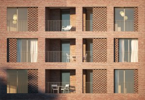 Studio AVENIER CORNEJO architectes navrhlo na břehu kanálu na předměstí Paříže obytný soubor třech domů s různým odstínem lícových cihel