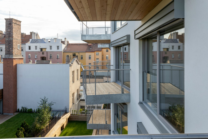 Bytový dům Sámova, Znamení čtyř - architekti