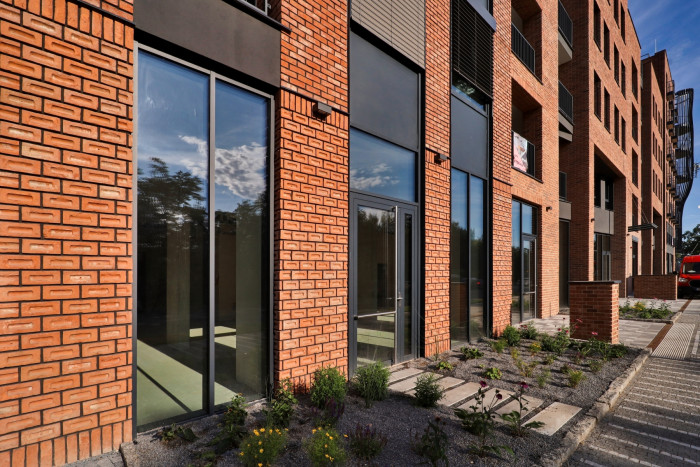 Cihlové fasády jsou trendem u rodinných i bytových domů.